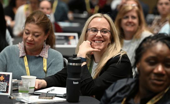 Core4 attendee listening to a presentation.
