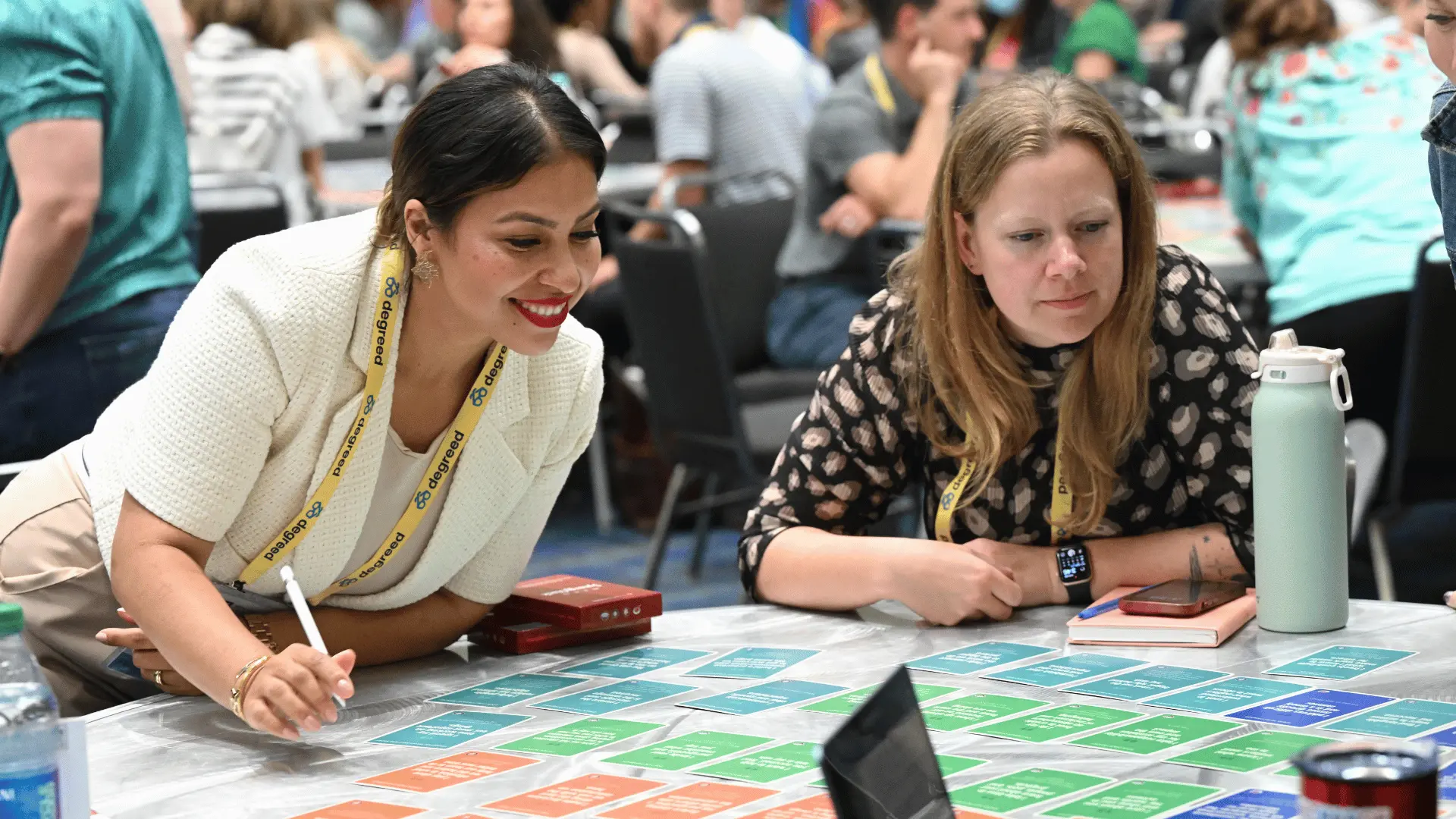 Core4 attendees collaborating at table.